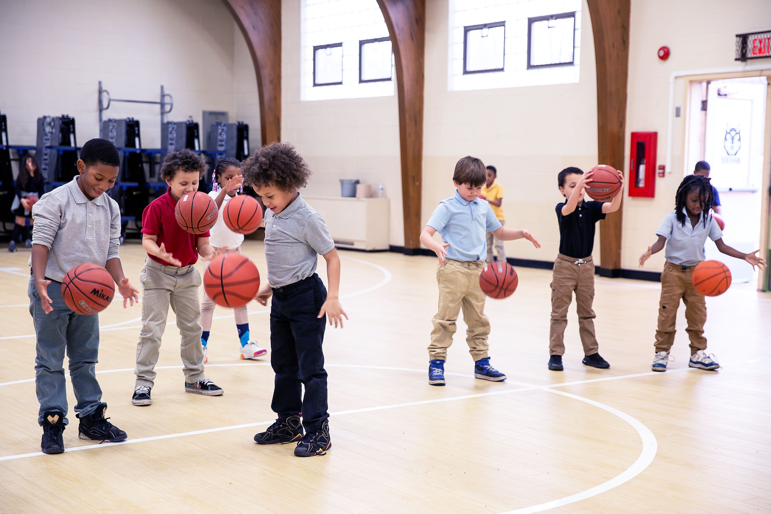 A group of elementary students playing basketball