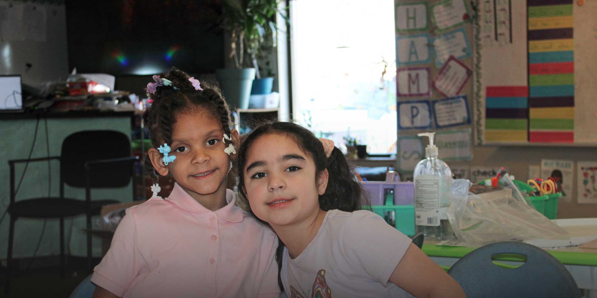 Two students sitting together in class