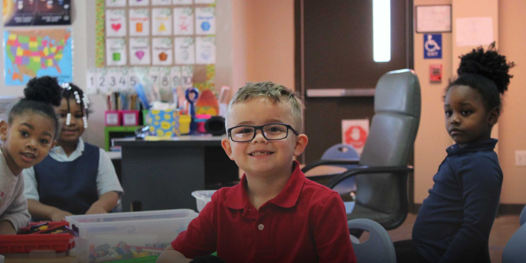 Student with glasses sitting in class